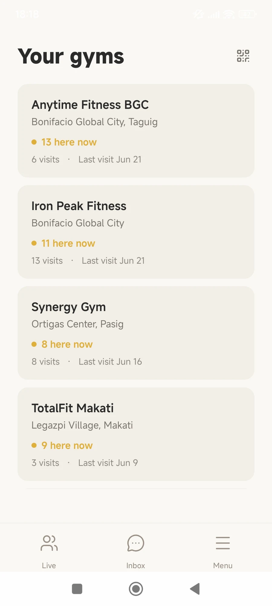 The 'Your gyms' screen in Spottr, listing your gyms with how many people are here right now